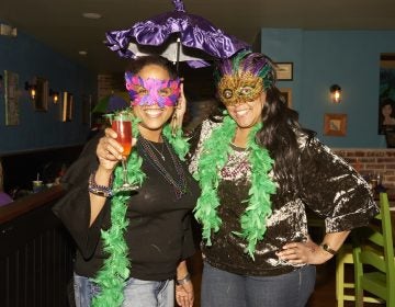 Marki and Deenee Levere celebrate Fat Tuesday at Acadia Bar in South Philadelphia. (Natalie Piserchio for WHYY)