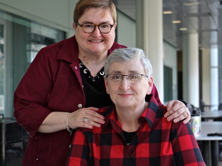 The Rev. Dr. Karyn Wiseman, a former United Methodist pastor (right), and her wife, Cindy Clawson. (Emma Lee/WHYY)