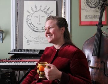 Philadelphia singer-songwriter Birdie Busch at her home studio in Germantown. Busch wrote eight original songs inspired by the art of women in the collection of the Philadelphia Museum of Art, and will perform them Friday night at the museum. (Emma Lee/WHYY)