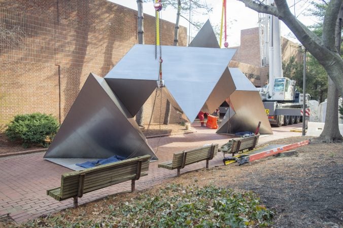 White Water, a sculpture by Philadelphia artist Robinson Fredenthal is moved from the garden behind the Wells Fargo building in Old City to its new home at the Woodmere Art Museum in Chestnut Hill. (Jonathan Wilson for WHYY)