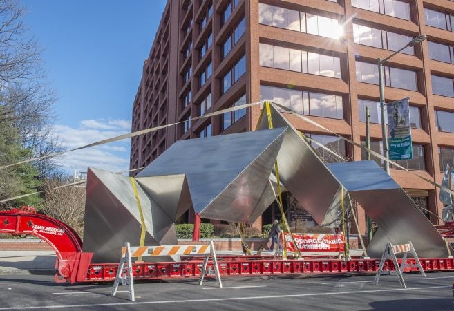 White Water, a sculpture by Philadelphia artist Robinson Fredenthal is moved from the garden behind the Wells Fargo building in Old City to its new home at the Woodmere Art Museum in Chestnut Hill. (Jonathan Wilson for WHYY)