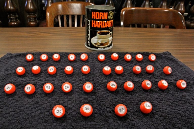 The method of determining ballot position in Philadelphia involves 34 numbered balls and a Horn & Hardart coffee can. (Emma Lee/WHYY)