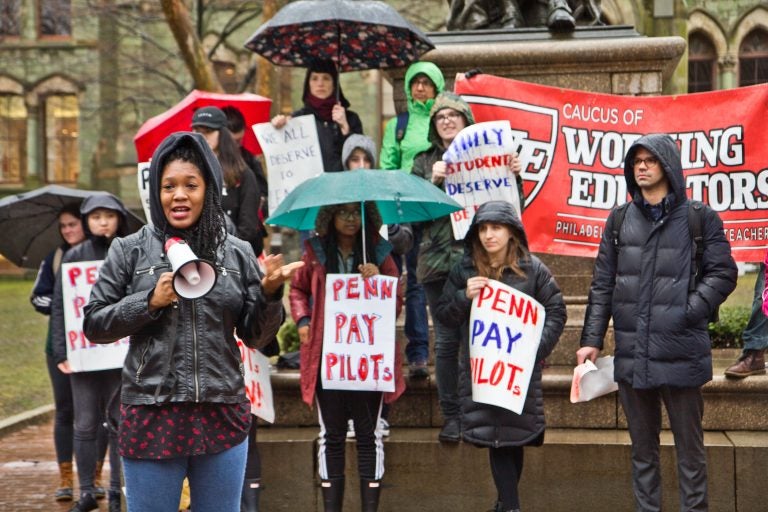 Gina Dukes, a Penn alumna and a Philadelphia school district teacher, speaks at a rally to demand UPenn make PILOT payments. (Kimberly Paynter/WHYY)