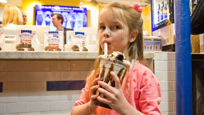 Bailey Stites, 5, tries the Tastykake and Bassetts Ice Cream collaboration milkshake. (Kimberly Paynter/WHYY)