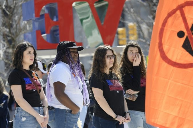 Close to 100 people participated in an anti-gun violence rally at LOVE Park, on Sunday, exactly one year after the nationwide student-led protests to call for gun reform following the mass shooting in Parkland, Florida. (Bastiaan Slabbers for WHYY)