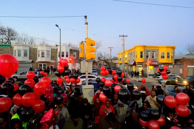 Black and red balloons fill the air as fans, friends and family mourn at a vigil for battle rapper Akeem Mickens (professionally known as Tech9) at the Happy Hollow playground, in Germantown, on Tuesday, January 26, 2019. (Bastiaan Slabbers for WHYY)