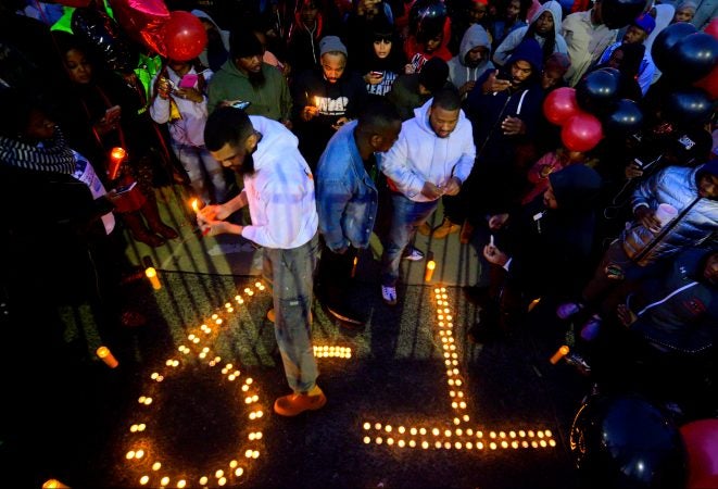 Hundreds of fans, friends and family mourn at a vigil for battle rapper Akeem Mickens (professionally known as Tech9) at the Happy Hollow playground, in the Germantown section of Philadelphia on Tuesday Jan 26, 2019. (Bastiaan Slabbers for WHYY)