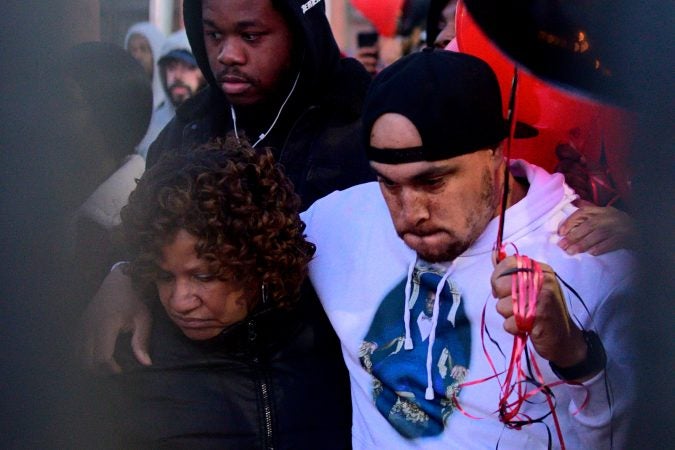 Hundreds of fans, friends and family mourn at a vigil for battle rapper Akeem Mickens (professionally known as Tech9) at the Happy Hollow playground, in Germantown, on Tuesday. (Bastiaan Slabbers for WHYY)