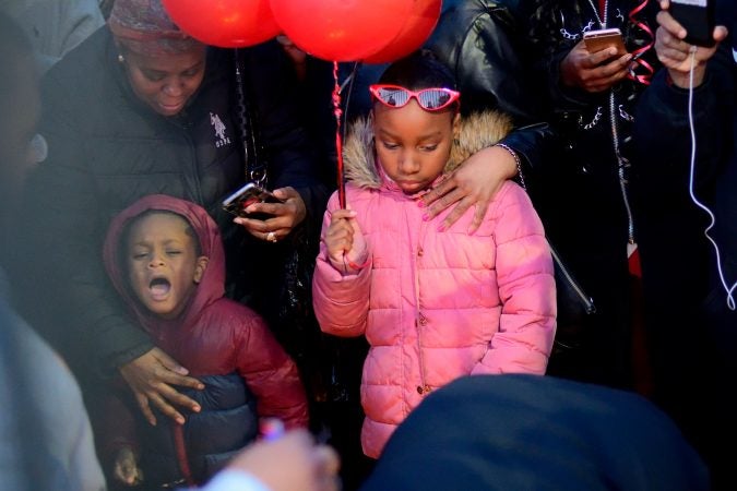 Hundreds of fans, friends and family mourn at a vigil for battle rapper Akeem Mickens (professionally known as Tech9) at the Happy Hollow playground, in Germantown, on Tuesday. (Bastiaan Slabbers for WHYY)