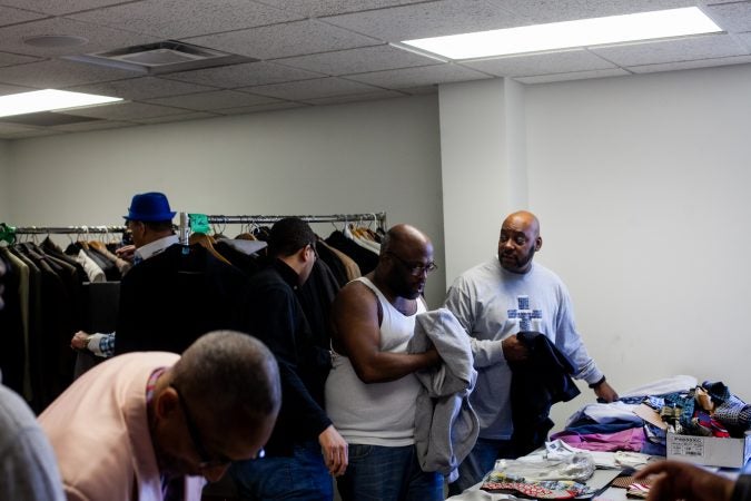 Suits and other clothing were given out to men at the Enon Tabernacle Baptist Church during the 2019 Men's Health Iniative Saturday. (Brad Larrison for WHYY)