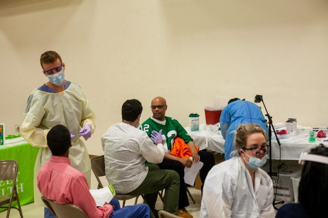 Temple University's School of Dentistry provides oral checkups to men at the 2019 Men's Health Initiative at Enon Tabernacle Baptist Church Saturday. (Brad Larrison for WHYY)