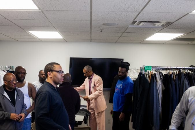 Suits and other clothing were given out to men at the Enon Tabernacle Baptist Church during the 2019 Men's Health Iniative Saturday. (Brad Larrison for WHYY)