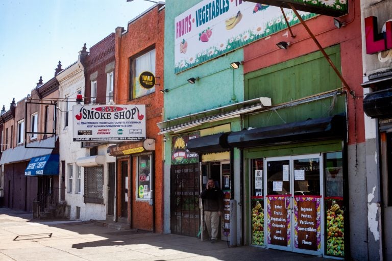 Abdelmgeed Muhammad Elgamel stands outside of his produce market on Allegheny Avenue in Kensington. (Brad Larrison/WHYY)