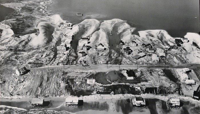 An Army Corps of Engineers aerial photograph shows the devastation from the March storm of 1962 in Harvey Cedars. The storm opened up a new inlet to Barnegat Bay near 79th street. The Army Corps of Engineers listed closing the inlet as a priority project in the expansive repairs the corps made along the Mid-Atlantic coast following the storm. (Courtesy of the Army Corps of Engineers) 