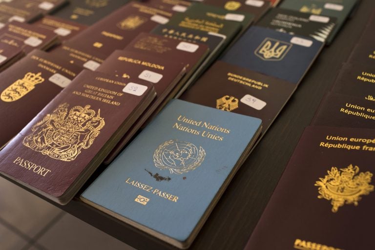 In this Wednesday, Feb. 28, 2018 file photo, authorities present confiscated passports and identification cards (Petros Giannakouris/AP Photo)