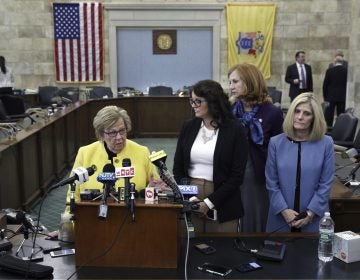 New Jersey state Senate Majority Leader Loretta Weinberg, left, D-Teaneck, stands with Assemblywoman Eliana Pintor Marin, second from left , D-Newark, N.J., state Sen. Nancy F. Munoz, second from right, R-Summit, N.J., and Kristin M. Corrado, R-Totowa, N.J., as they address a gathering after Katie Brennan, not seen, the chief of staff at the New Jersey Housing and Mortgage Finance Agency, testified before the Select Oversight Committee at the Statehouse, Tuesday, Dec. 4, 2018, in Trenton, N.J. Brennan, a top staffer at the state's housing agency who came forward as a sexual assault victim, and has said too little was done about her complaints, which she reported to law enforcement. (AP Photo/Mel Evans)
