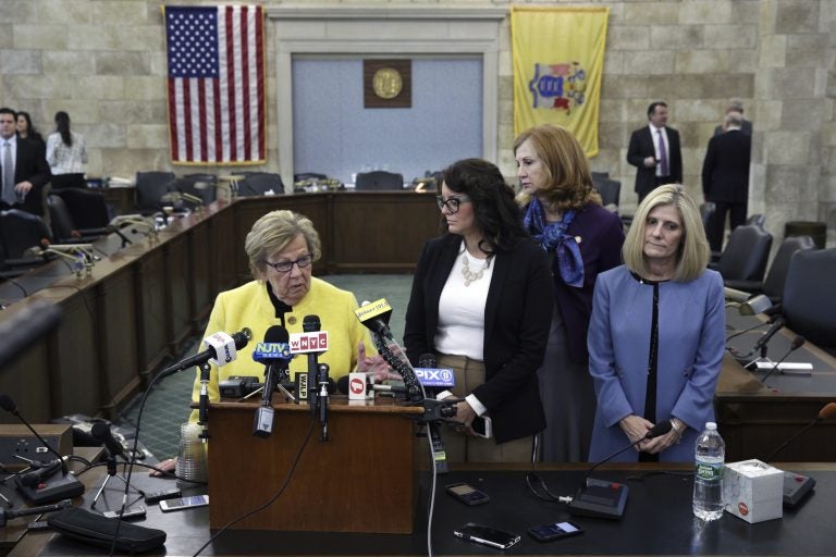 New Jersey state Senate Majority Leader Loretta Weinberg, left, D-Teaneck, stands with Assemblywoman Eliana Pintor Marin, second from left , D-Newark, N.J., state Sen. Nancy F. Munoz, second from right, R-Summit, N.J., and Kristin M. Corrado, R-Totowa, N.J., as they address a gathering after Katie Brennan, not seen, the chief of staff at the New Jersey Housing and Mortgage Finance Agency, testified before the Select Oversight Committee at the Statehouse, Tuesday, Dec. 4, 2018, in Trenton, N.J. Brennan, a top staffer at the state's housing agency who came forward as a sexual assault victim, and has said too little was done about her complaints, which she reported to law enforcement. (AP Photo/Mel Evans)