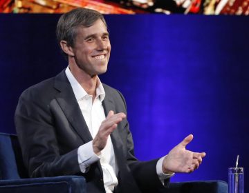 Former Democratic Texas congressman Beto O'Rourke laughs as with Oprah Winfrey presses him to make the announcement that he is running for president during a live interview on a Times Square stage at 