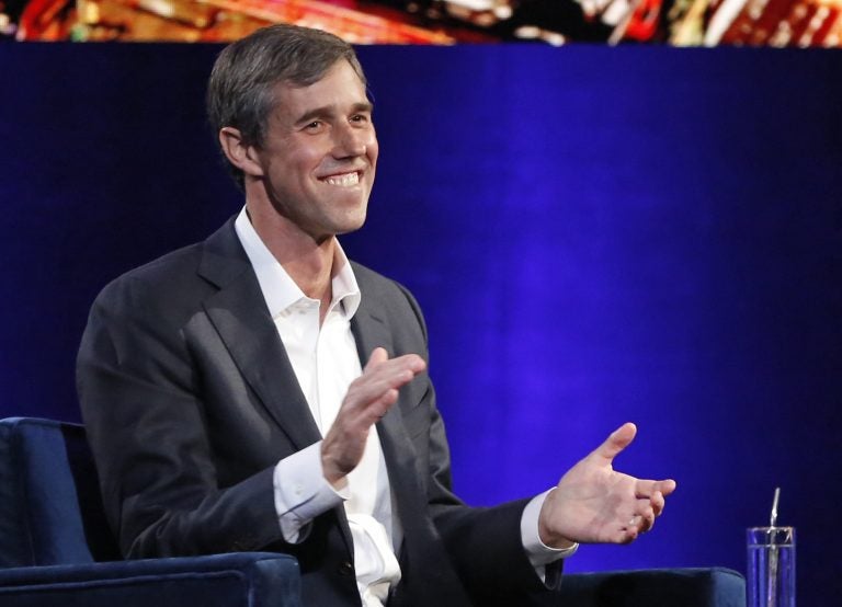 Former Democratic Texas congressman Beto O'Rourke laughs as with Oprah Winfrey presses him to make the announcement that he is running for president during a live interview on a Times Square stage at 