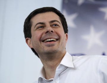 Mayor Pete Buttigieg, of South Bend, Indiana, smiles as he listens to a question during a stop in Raymond, N.H., Saturday, Feb. 16, 2019. Buttigieg is weighing a run in the 2020 presidential race. (AP Photo/Charles Krupa)