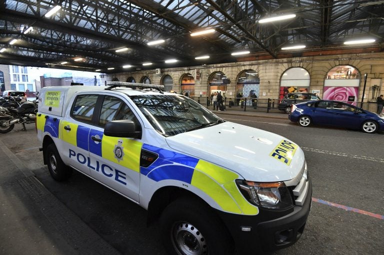 A British Transport Police vehicle is seen at Waterloo Railway Station, after three small improvised explosive devices were found at buildings at Heathrow Airport, London City Airport and Waterloo in London, Tuesday, March 5, 2019. (John Stillwell/PA via AP)