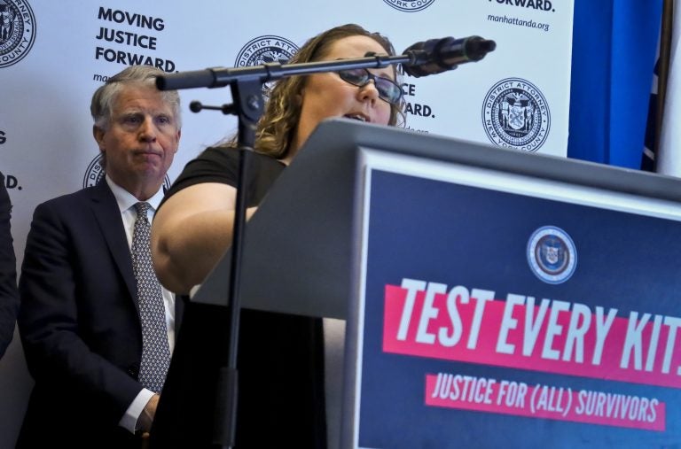 Manhattan District Attorney Cyrus Vance, (left), listens while sexual assault survivor Tracy Rios speaks about her attack, during a press conference, Tuesday March 12, 2019, in New York. Vance released results of a $38 million national initiative to help law enforcement agencies perform DNA tests on evidence in thousands of languishing rape cases. (Bebeto Matthews/AP Photo)