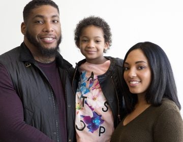 In this April 12, 2016, file photo, Devon Still and his fiancee, Asha Joyce, pose with their daughter, Leah, then 5, in New York. (Mark Lennihan/AP Photo, File)