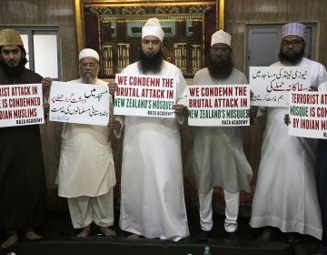 Indian Muslims hold placards during a condolence meeting and protest against Fridays mass shootings in New Zealand in Mumbai, India, Friday, March. 15, 2019. Dozens of people were killed in mass shootings at two mosques full of worshippers attending Friday prayers on what the prime minister called 