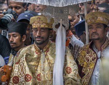 A priest cries at a mass funeral at the Holy Trinity Cathedral in Addis Ababa, Ethiopia Sunday, March 17, 2019. Thousands of Ethiopians have turned out to a mass funeral ceremony in the capital one week after the Ethiopian Airlines plane crash. (Mulugeta Ayene/AP Photo)