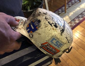 Retired coal miner John Robinson displays his mining helmet at his home in Coeburn, Va., on Thursday, Jan. 24, 2019. Robinson was 47 when he was diagnosed with black lung disease, part of a new generation of black lung sufferers who are contracting the deadly disease at younger ages. (Dylan Lovan/AP Photo)