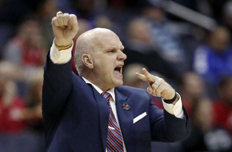 In this March 10, 2018, file photo Saint Joseph's head coach Phil Martelli directs his team during the first half of an NCAA college basketball semifinal game against Rhode Island in the Atlantic 10 Conference tournament in Washington. Saint Joseph's fired Martelli on Tuesday, March 19, 2019, after 24 seasons. The 64-year-old Martelli became head coach in 1995 after 10 years as an assistant.  (Alex Brandon/AP Photo, File)