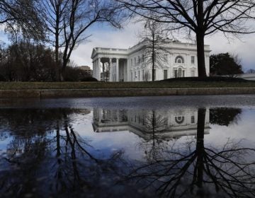 The White House is reflected in a puddle, Friday March 22, 2019, in Washington, as news breaks that the special counsel Robert Mueller has concluded his investigation into Russian election interference and possible coordination with associates of President Donald Trump. (Jacquelyn Martin/AP Photo)