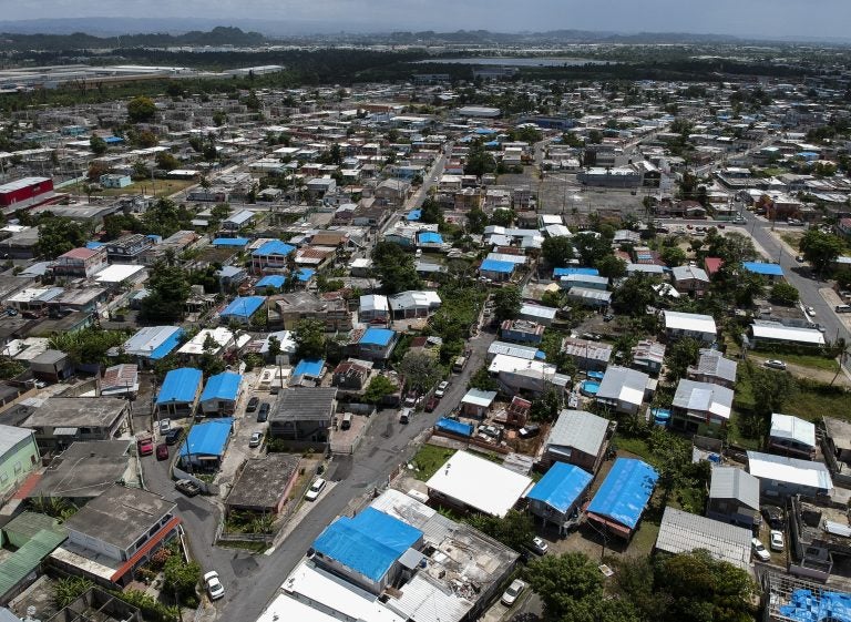This June 18, 2018, file photo shows an aerial view of the Amelia neighborhood in the municipality of Catano, east of San Juan, Puerto Rico. (Dennis M. Rivera/AP Photo)