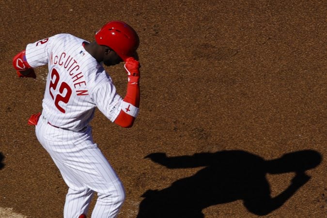 Philadelphia Phillies' Andrew McCutchen tips his helmet as he heads to home base after hitting a home run off Atlanta Braves starting pitcher Julio Teheran, right, during the first inning of an opening day baseball game, Thursday, March 28, 2019, in Philadelphia. (AP Photo/Matt Rourke)