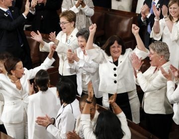 In this Feb. 5, 2019 file photo, women members of Congress cheer after President Donald Trump acknowledges more women in Congress during his State of the Union address to a joint session of Congress on Capitol Hill in Washington. A new survey finds acceptance of women in American politics and the workforce is at a record high. (J. Scott Applewhite/AP Photo)