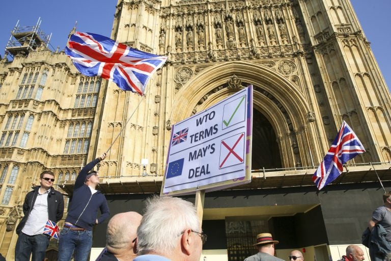 Protesters are seen with placards and Union Jack flags in front of Victoria Tower during the demonstration. Leave campaigners protest against the delay to Brexit, on the day that UK was due to leave the European Union. British Prime Minister Theresa May's Brexit deal was defeated for a third time by a margin of 58 votes. (Photo by Dinendra Haria/SOPA Images/Sipa USA via AP Images)