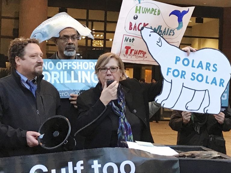 In this Feb. 15, 2018 file photo, Judith Enck, (center), former regional administrator for the Environmental Protection Agency addresses those gathered at a protest against President Trump's plan to expand offshore drilling for oil and gas in Albany, N.Y.  A U.S. judge in Alaska says President Donald Trump exceeded his authority when he reversed a ban on offshore drilling in vast parts of the Arctic Ocean and dozens of canyons in the Atlantic Ocean. (David Klepper/AP Photo, File)