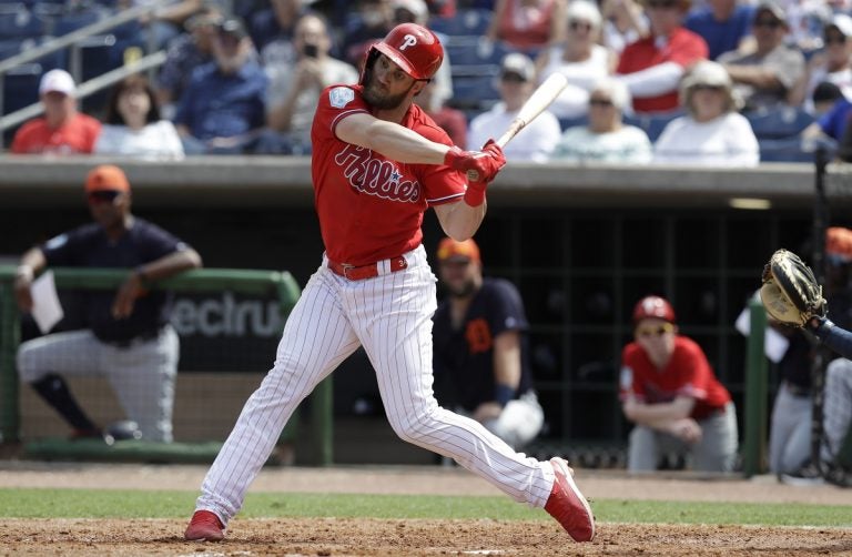 Philadelphia Phillies' Bryce Harper bats against the Detroit Tigers during the seventh inning of a spring training baseball game Wednesday, March 20, 2019, in Clearwater, Fla. (AP Photo/Chris O'Meara)