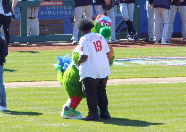 Questlove threw out the first pitch at the Phillies 2019 opening day game. (Ximena Conde/WHYY)