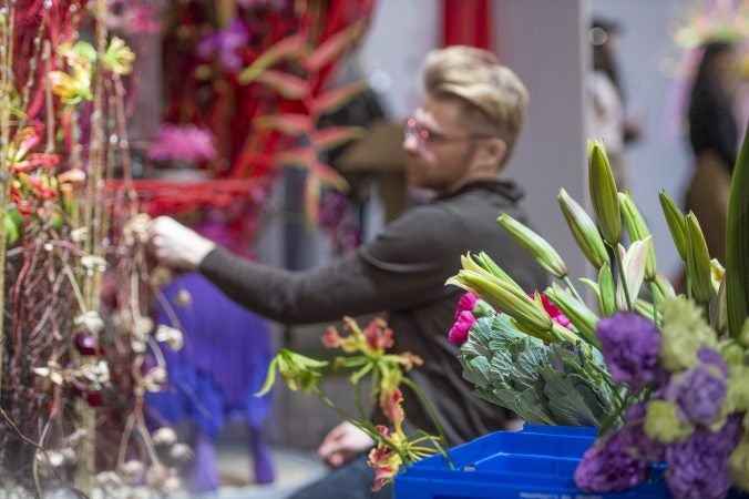 With an hour left in the two-hour semi-final round, Přemysl Hytych of the Czech Republic adds flowers to his arrangement. (Jonathan Wilson for WHYY)