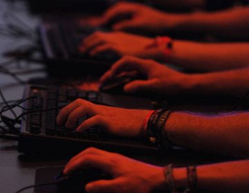 Computer gamers play in front of their screens on August 18, 2011. (Patrik Stollarz/AFP/Getty Images)
