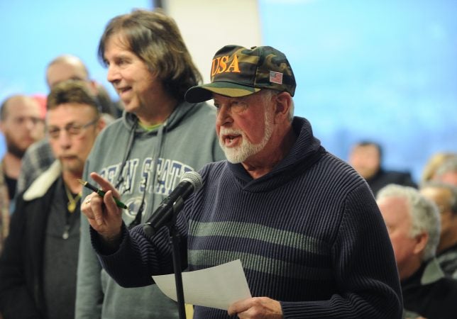 Bob Bolus, of Scranton, voices his disapproval with recreational use of marijuana during Fetterman's Lackawanna County stop. (Matt Smith for WHYY)