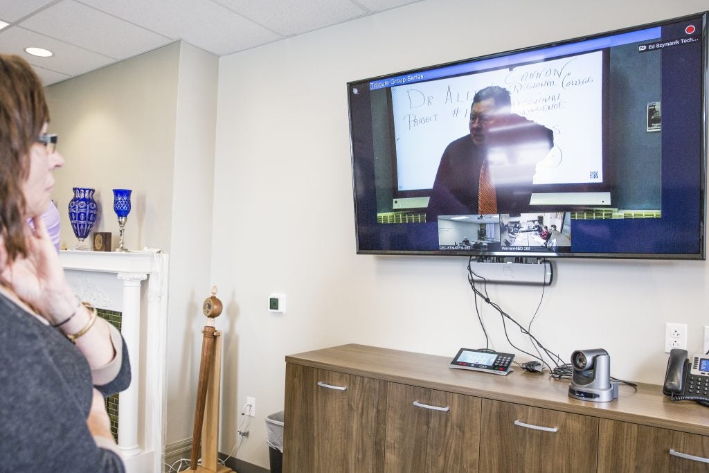 Attendants watch the showcase of a live video conference during an open house event at the Northern Pennsylvanian Regional College in Warren, Pa. (Photo by Min Xian/Keystone Crossroads)