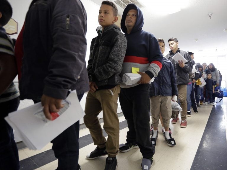 A line of migrants released by U.S. immigration authorities waits to check in at the Catholic Charities shelter in McAllen, Texas on Jan. 11. A line of migrants released by U.S. immigration authorities waits to check in at the Catholic Charities shelter in McAllen, Texas on Jan. 11. (Eric Gay/AP Photo)