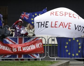 Pro-Brexit leave the European Union supporters and anti-Brexit remain in the European Union supporters take part in a protest outside the Houses of Parliament in London, Tuesday, March 12, 2019. British Prime Minister Theresa May faced continued opposition to her European Union divorce deal Tuesday despite announcing what she described as 