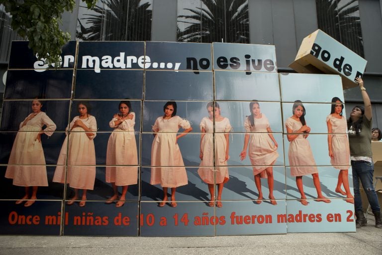 A billboard built by sex education advocates outside Mexico’s National Population Council office, in Mexico City, warns that ‘being a mother is not child’s play.’ (Rebecca Blackwell/AP Photo)
