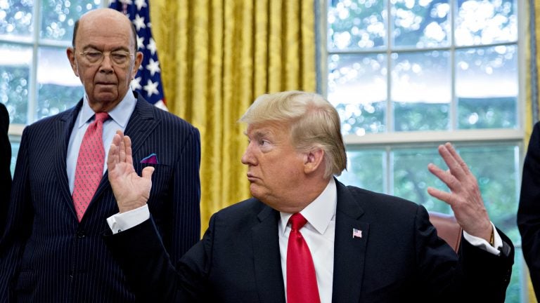 Commerce Secretary Wilbur Ross stands behind President Trump at the White House in 2018. Ross, who oversees the Census Bureau, approved adding to the 2020 census a question asking, 