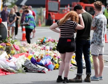 Residents pay their respects by placing flowers for the victims of the mosques attacks in Christchurch. (Michael Bradley/AFP/Getty Images)