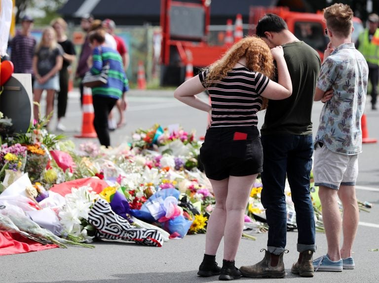 Residents pay their respects by placing flowers for the victims of the mosques attacks in Christchurch. (Michael Bradley/AFP/Getty Images)
