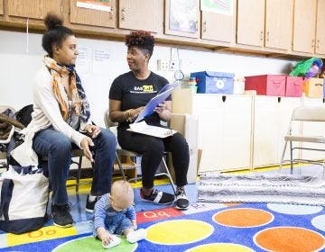 Jabina Coleman (right) introduces herself to Pamela Newman and  3-month-old James at the Lucien E. Blackwell library. Coleman leads a breastfeeding class and co-runs the Prenatal Mental Health Alliance for Women of Color. In  February, some mothers described experiencing postpartum depression. (Rachel Wisniewski/ For the Philadelphia Inquirer)